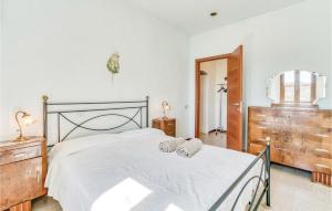 A bed or beds in a room at Tenuta Erbanera