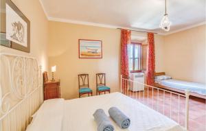A bed or beds in a room at Tenuta Erbanera