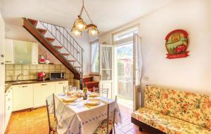 a kitchen and dining room with a table and a couch at Casa Tommasi in Stazzema