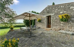 a table with an umbrella in front of a building at Casa Di Caccia in Case Riminino +19 photos