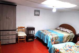Rúm í herbergi á Cuzco Central Hostel