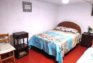 Rúm í herbergi á Cuzco Central Hostel