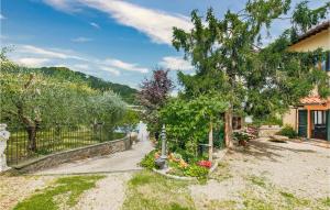 a house with a fence and a garden at Fiorita in Mosciano