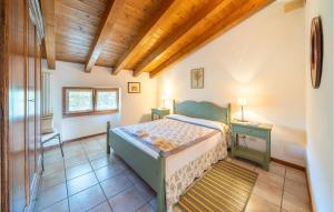 a bedroom with a bed and a table and a window at Macchia Blu in Caprino Veronese
