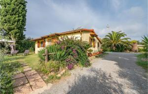 a house with a bench and flowers in front of it at Casa Leo in Casa SantʼEugenia
