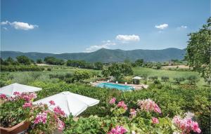 a resort with a pool and mountains in the background at Beautiful Home In Acquasparta -Tr- in Configni