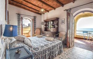 a bedroom with a bed and a view of the ocean at Cozy Home In Tarquinia Vt With Wifi in Tarquinia