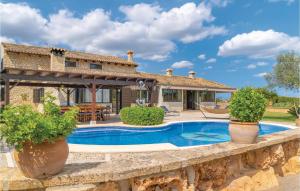 a villa with a swimming pool and a house at 4 Bedroom Lovely Home In Muro in San Lorenzo