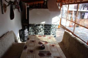 a long table in a room with a fireplace at Apartment Raya in Sapareva Banya