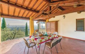 a dining room with a table and chairs on a patio at La Veranda in San Giustino Valdarno