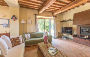 a living room with a couch and a fireplace at Podere Case Sparse in Citerna
