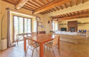 a living room with a wooden table and chairs at Podere Case Sparse in Citerna