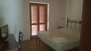 Posteľ alebo postele v izbe v ubytovaní Agriturismo Monte dell'Olmo