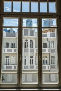 a view of a building through a window at The Norman Tel Aviv in Tel Aviv