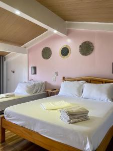 Postel nebo postele na pokoji v ubytování Balai Tinay Guesthouse