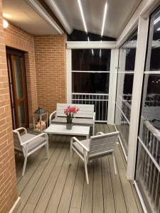 A balcony or terrace at AGM Suite Rome Airport FCO - Attico Parco Leonardo