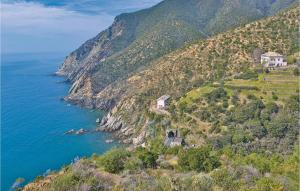 a house on a hill next to the ocean at Casa Relax In Collina in Castiglione Chiavarese