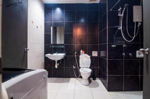 a bathroom with a toilet and a sink at DPULZE Residence By IdealHub in Cyberjaya +53 photos