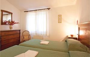 A bed or beds in a room at Il Molino - Casale Il Picchio