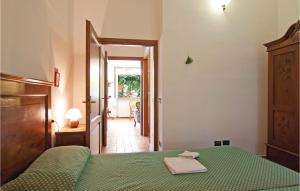A bed or beds in a room at Il Molino - Casale Il Picchio