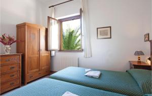 A bed or beds in a room at Il Molino - Casale Il Picchio