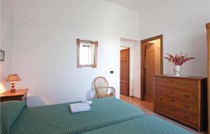 A bed or beds in a room at Il Molino - Casale Il Picchio