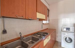 A kitchen or kitchenette at Appartamento Eden