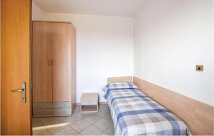 A bed or beds in a room at Appartamento Eden