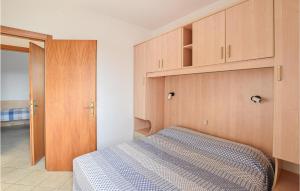 A bed or beds in a room at Appartamento Eden