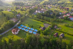 an aerial view of a house with a yard at Domki Żaklin in Berezka