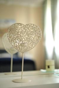 a paper heart on a table in a room at Charming Apartment in Historical City Center in Timişoara
