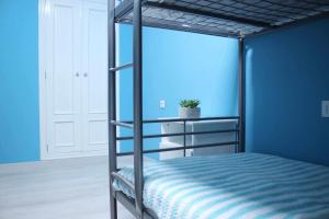 A bed or beds in a room at El PISO MAS CÉNTRICO DEL HUMEDO DESAYUNO INCLUIDO