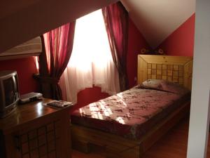 Postel nebo postele na pokoji v ubytování Vidin Hotel