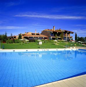 a large swimming pool in front of a house at Parador de Segovia in Segovia