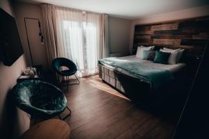 Een bed of bedden in een kamer bij Strandhotel Zoutelande