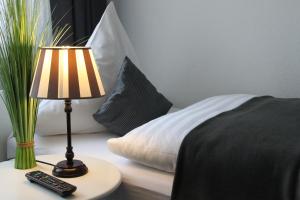 Postel nebo postele na pokoji v ubytování Hotel KAUP