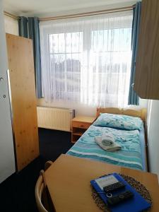 Postel nebo postele na pokoji v ubytování Pension Pastis