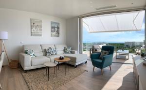 Część wypoczynkowa w obiekcie Las Colinas Golf - Naranjo 60 Penthouse