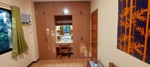 a small bathroom with a sink and a mirror at Le Chateau Residences in Bacolod