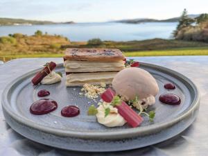
a plate of food on a table at Loch Melfort Hotel in Ardfern
