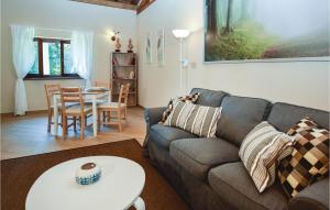 a living room with a couch and a table at Gorgeous Home In Fabrica Di Roma -Lt- in Fabrica di Roma