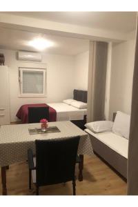 Postel nebo postele na pokoji v ubytování Grapevine Studio Apartment