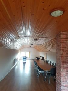 a conference room with a table and chairs in it at Vila Sanne Brașov , Hălchiu in Heldsdorf