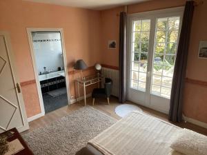 Postel nebo postele na pokoji v ubytování Un petit coin de paradis