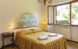 En eller flere senger på et rom på Villa Il Cedro