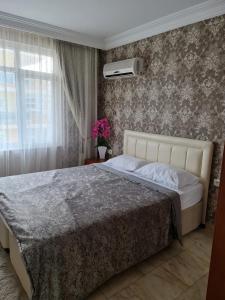 En eller flere senge i et værelse på Barbaros Cd no 201 Апартаменты