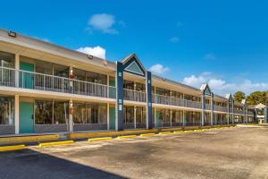 an empty parking lot in front of a building at Clarion Inn & Suites in Florence