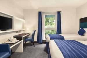 Postel nebo postele na pokoji v ubytování Ramada Oxford