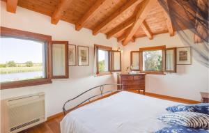 A bed or beds in a room at Porta Di Valle 1