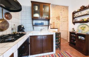 Kuchyň nebo kuchyňský kout v ubytování Holiday Home Cornino Tp With Fireplace I